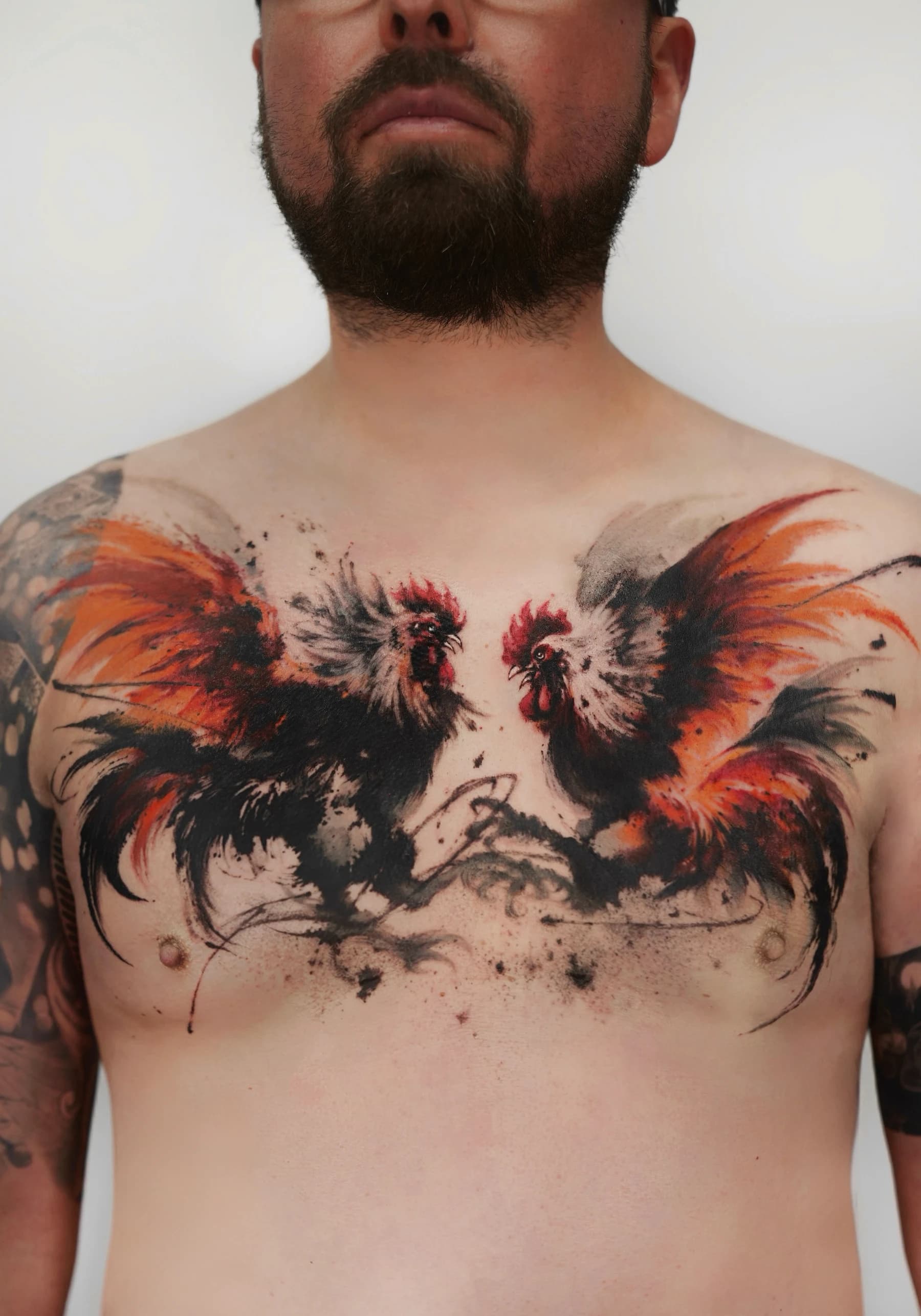 Neo-traditional Chinese ink tattoo of two fighting chickens on the chest